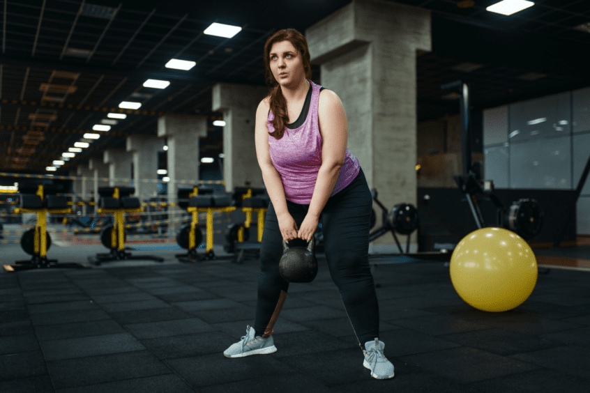 woman doing kettlebell swings